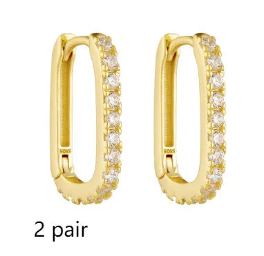 Sterling silver oval zircon ear clip earrings with geometric design in yellow and white options