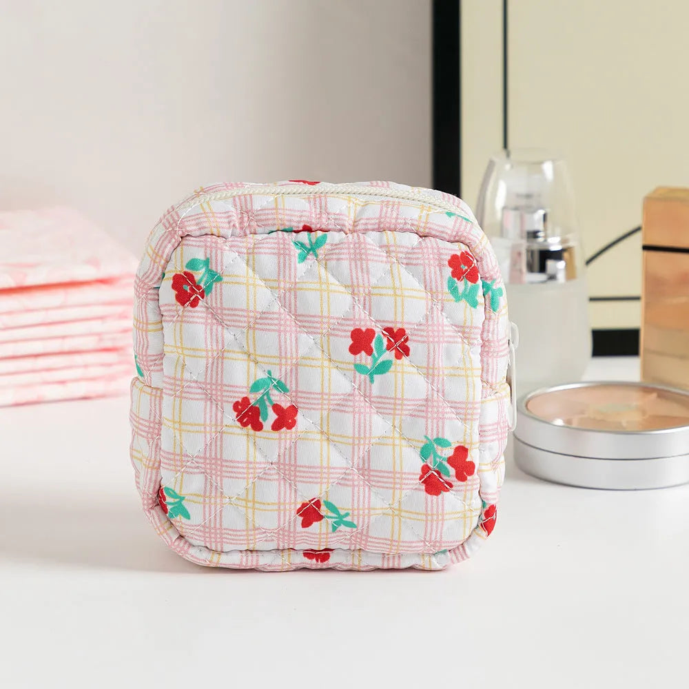 Floral polyester key storage bag with sewing thread detailing in multiple colour patterns
