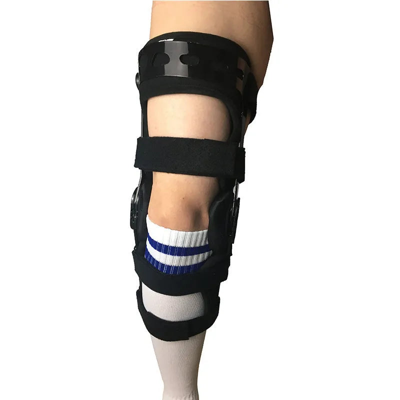 Black anterior ligament knee supporter showing sponge padding and brushed cloth lining, with size tags for left and right legs.