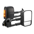 Black electric exterior wing mirror for Nissan NP300 Navara with large glass and integrated light.