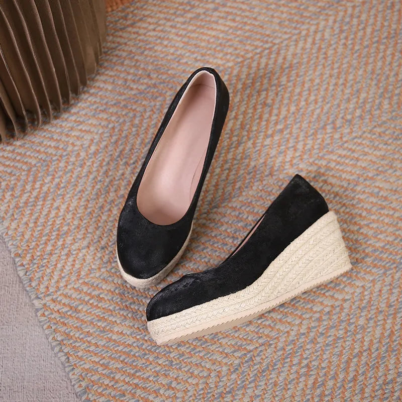 Apricot wedge heel pumps with a thick sole and rope-strap detail across the shallow mouth.