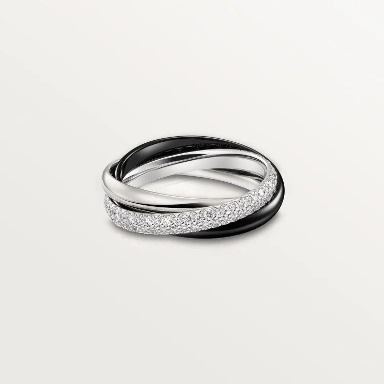 Silver couple rings showing full diamond setting and plain band options on a ring box.