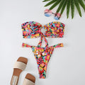 Women's floral printed tube top ring bikini set with backless design on mannequin