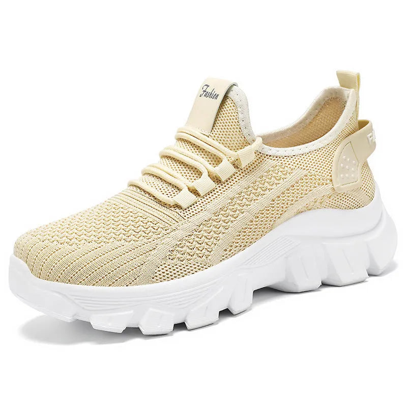 Women's white Flyknit running sneakers with thick PVC sole and lace-up front