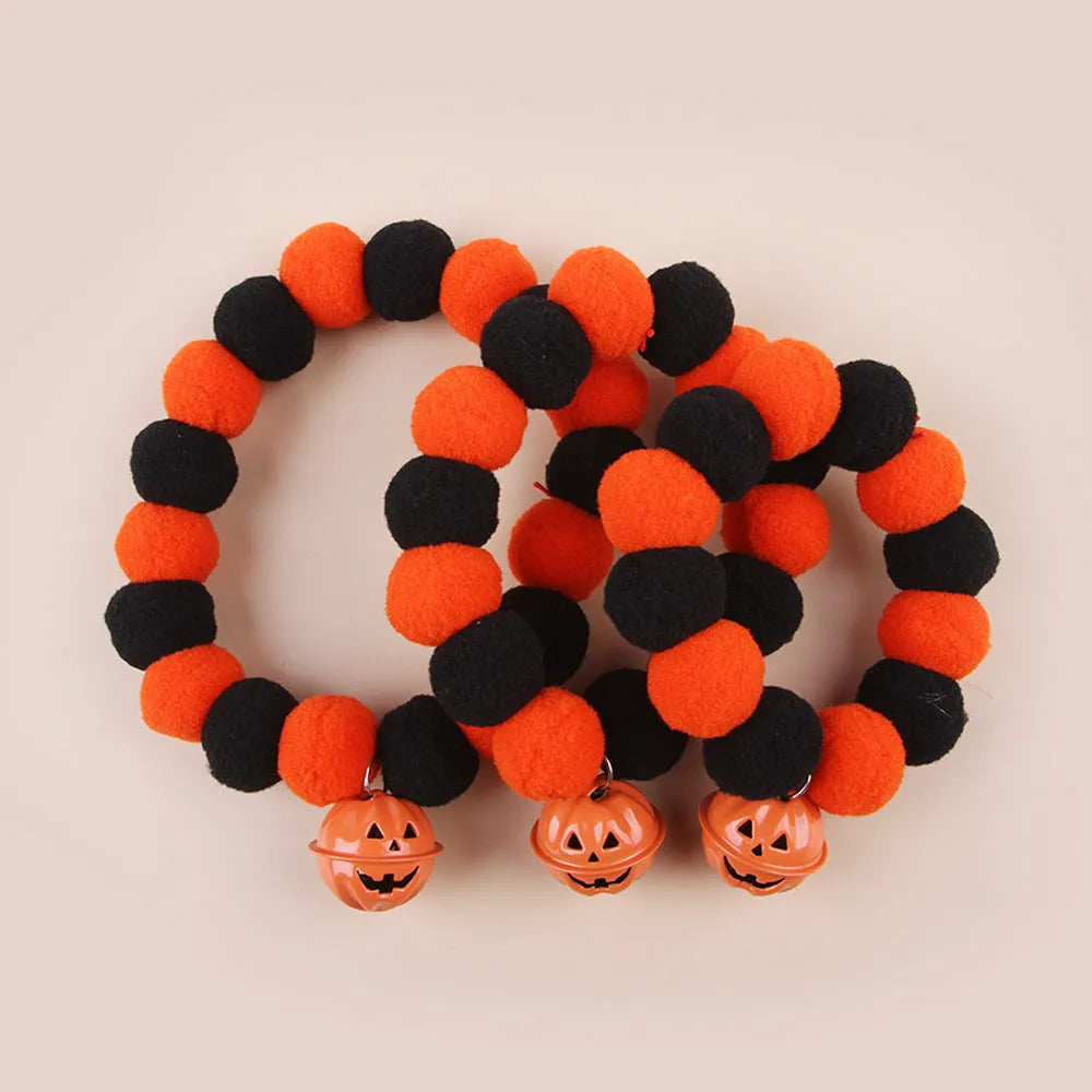 Black and orange Halloween cat collar with a trick or treat pumpkin graphic, shown in small, medium, and large sizes.