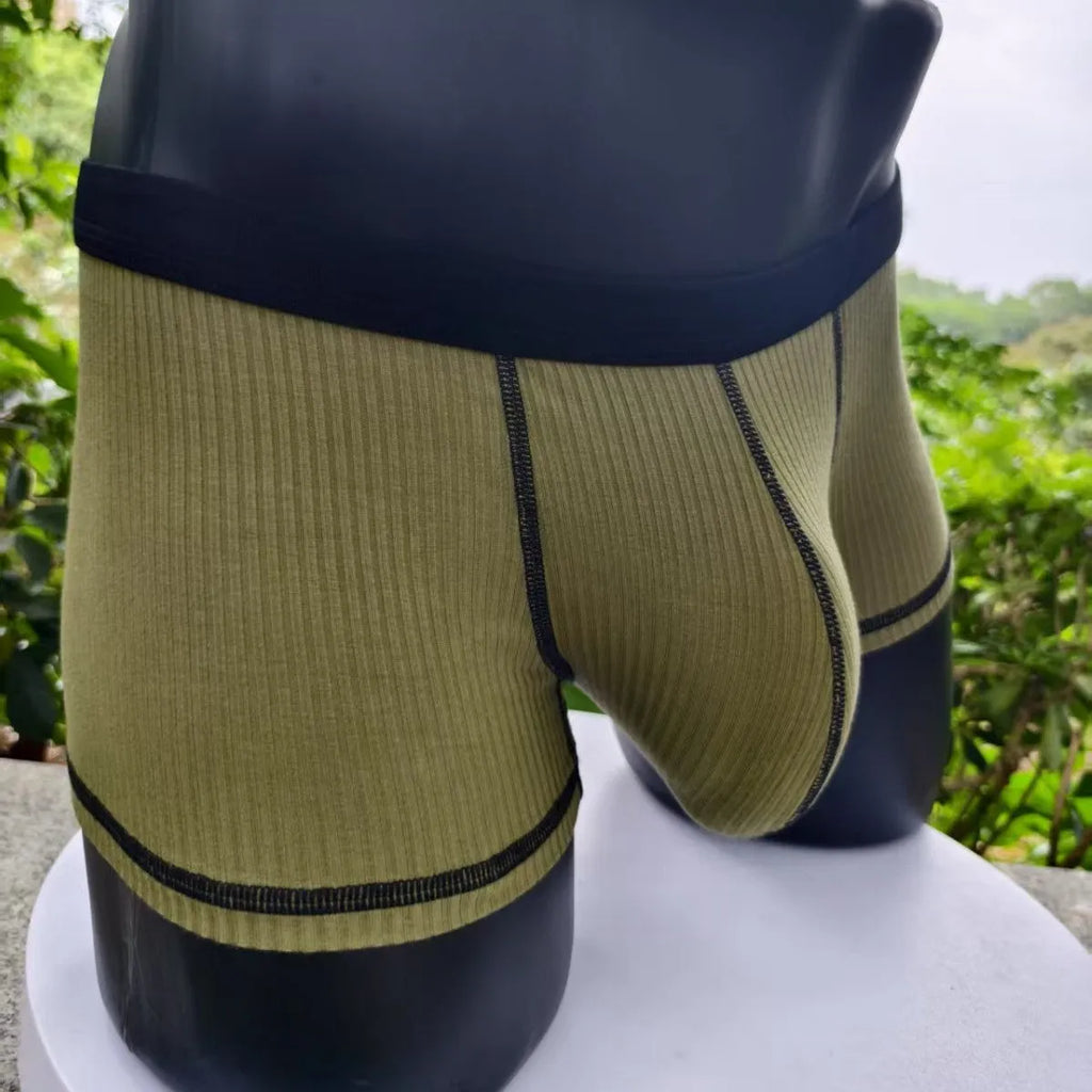 Men's thin fibre boxer shorts in army green, shown laid flat to display hip lift design.