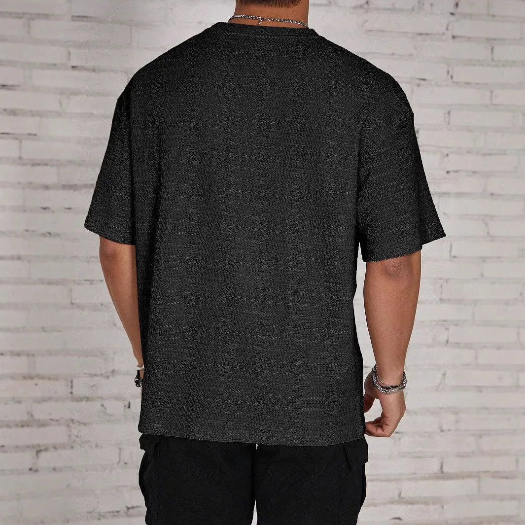 Men's slim fit polyester t-shirt in black colour with round neck and short sleeves
