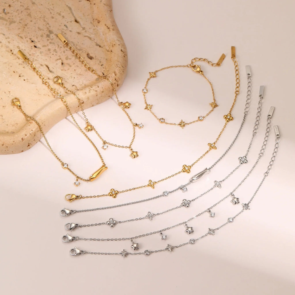 Women's stainless steel bracelet with 18K gold plating and a geometric hexagonal star zircon pendant.