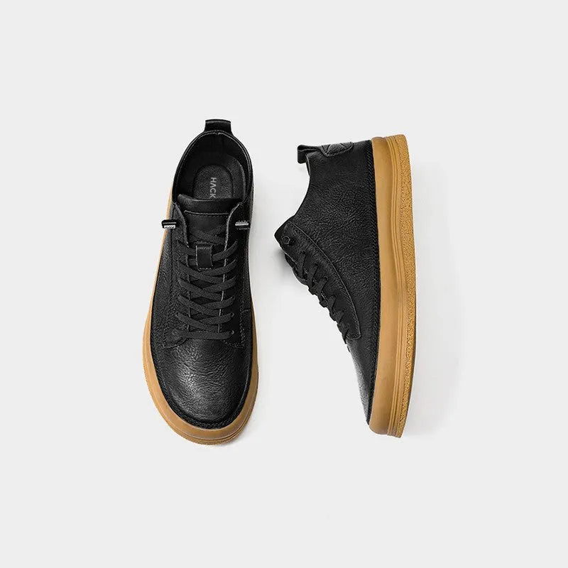 Men's black leather casual shoes with round toe, flat heel, and white lace-up closure.