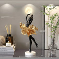 Small resin night light ornament in black gold colour with USB charging cable