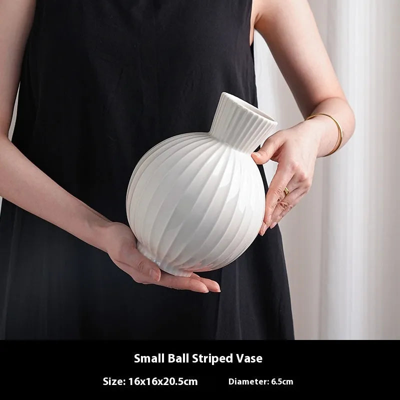 White ball-shaped ceramic vase with stripes, an American country style living room table decoration.