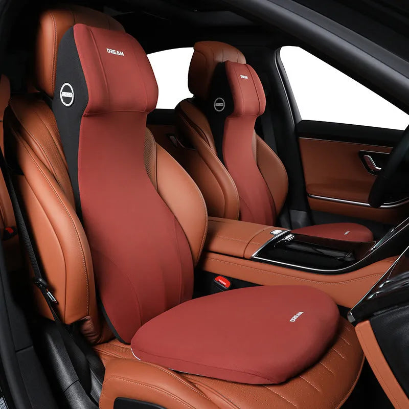Black automotive memory foam headrest and lumbar cushion combined in one piece on a car seat.