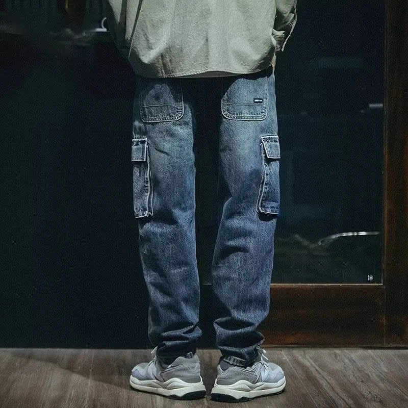 Men's blue loose straight-leg denim trousers with zip fly on mannequin