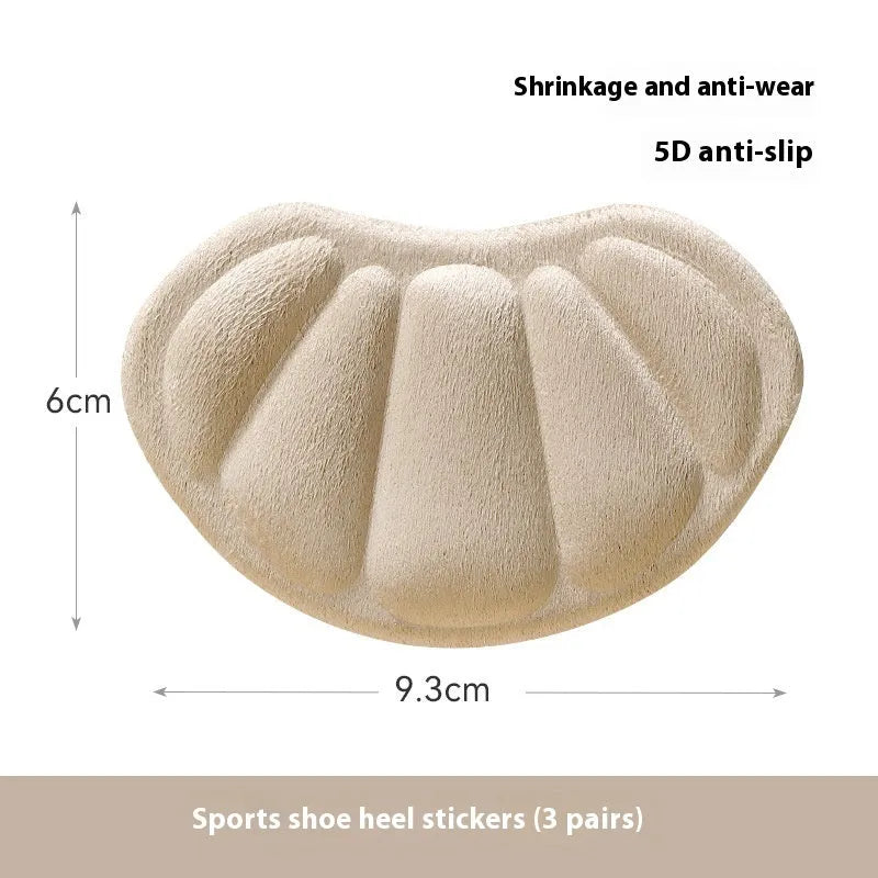 Three pairs of camel-coloured suede heel cushion pads for women's shoes on a white background.