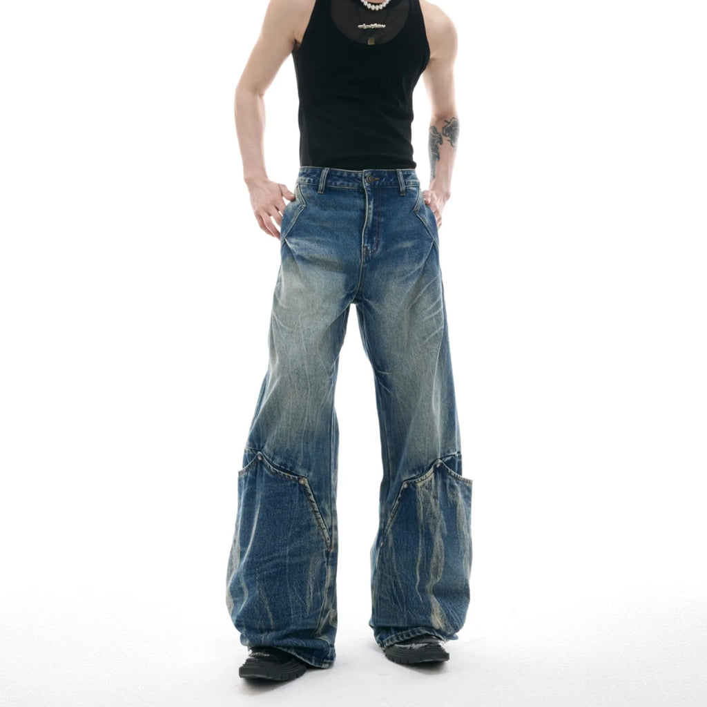 Men's verdant blue loose fit jeans with retro washed finish and curved knife design detail