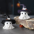 Resin wizard hat holiday ornament in purple or black, 7cm tall.