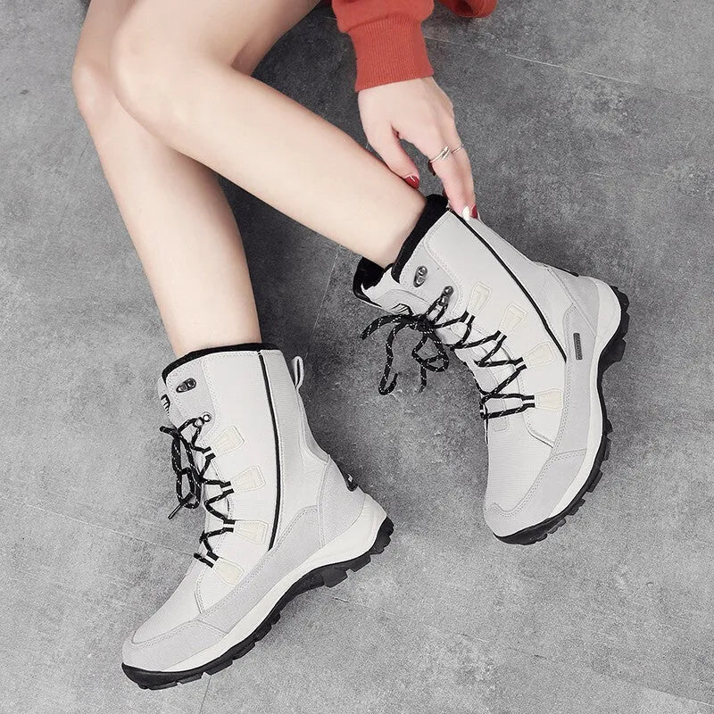 Women's mid-calf thermal snow boots in black with genuine leather upper and rubber sole