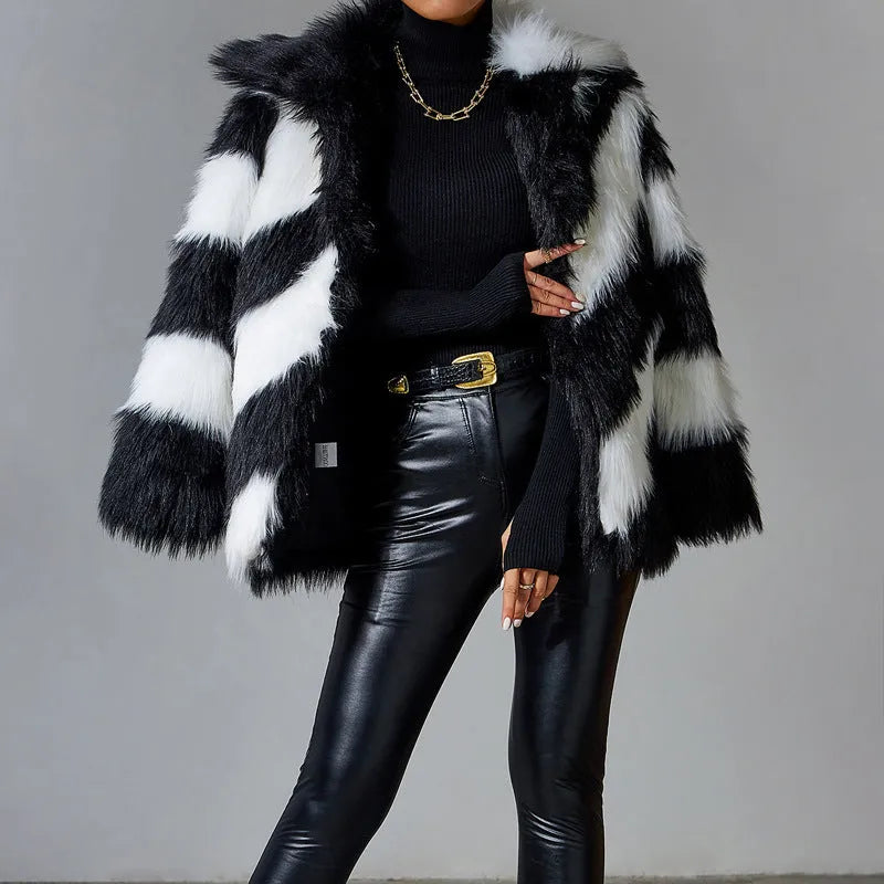 Faux fur coat with contrasting colour lapel and a attached fur collar.