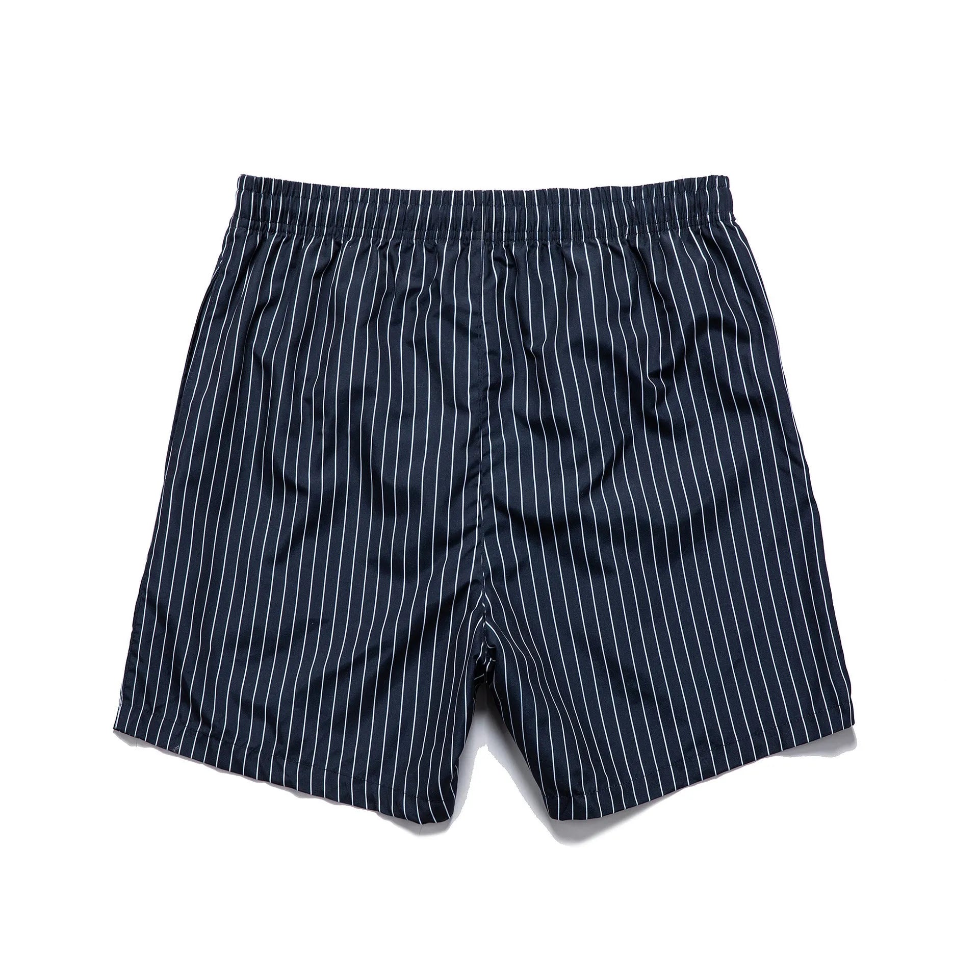 Navy blue and grey striped beach shorts with a straight leg opening on a mannequin.