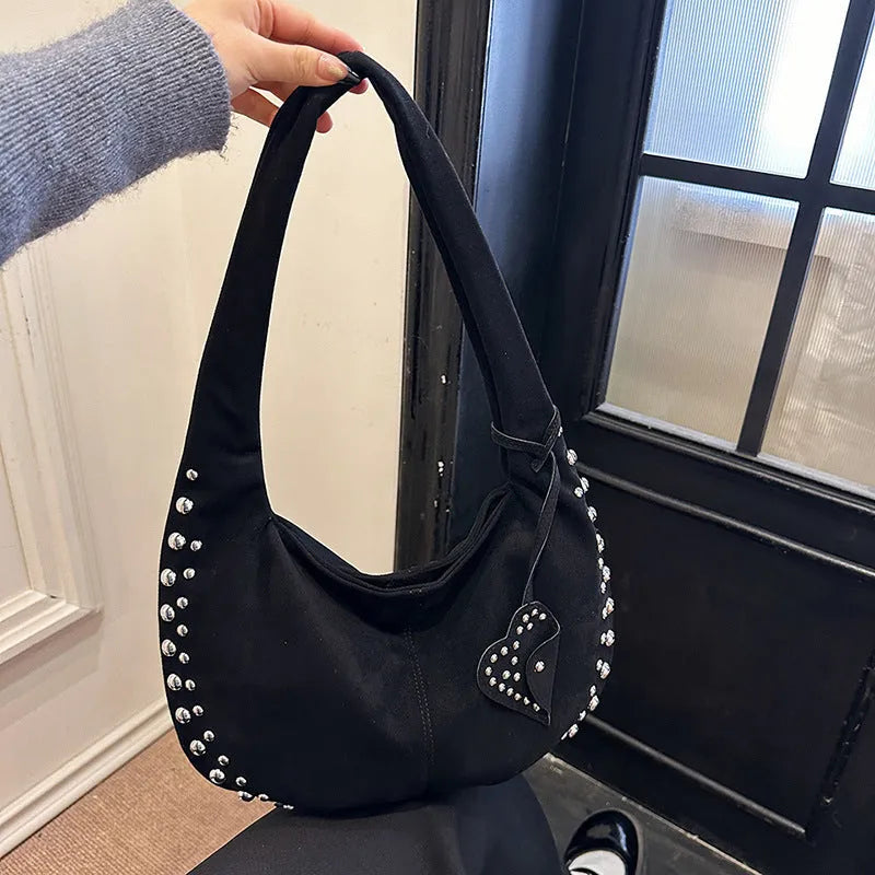 A soft plush underarm tote handbag in a retro style, shown in a colour option.