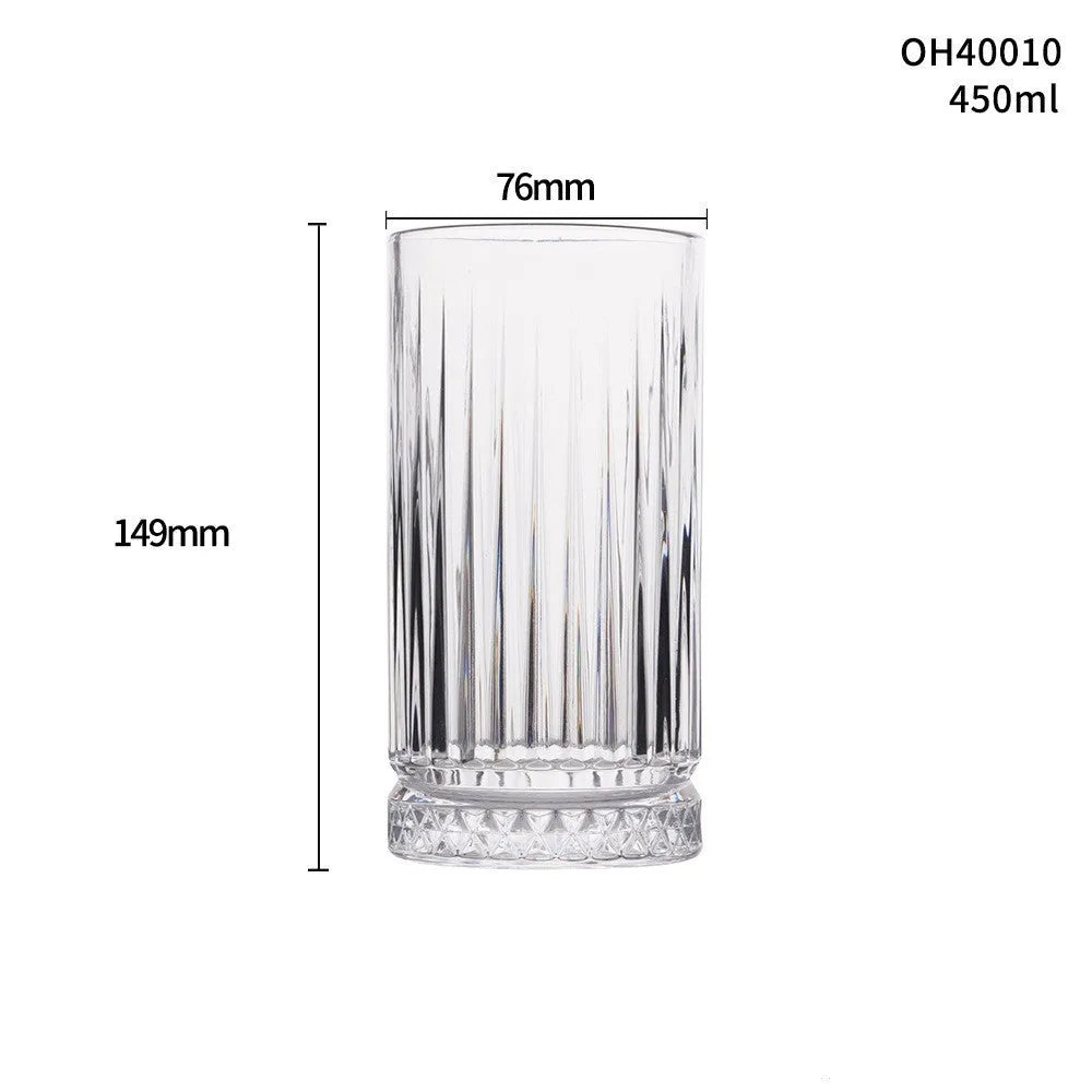 Clear thick-bottom whiskey shot glass with 301-400ml capacity on a table.