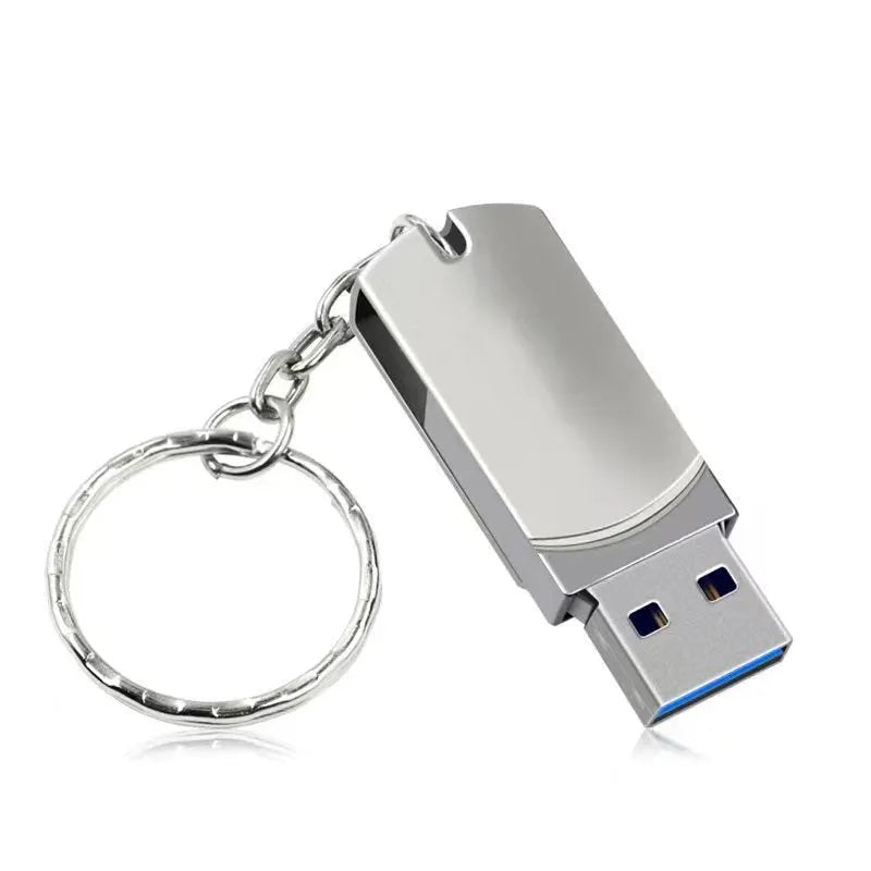 White rotating metal USB flash drive with 16GB capacity shown next to a ruler for scale.