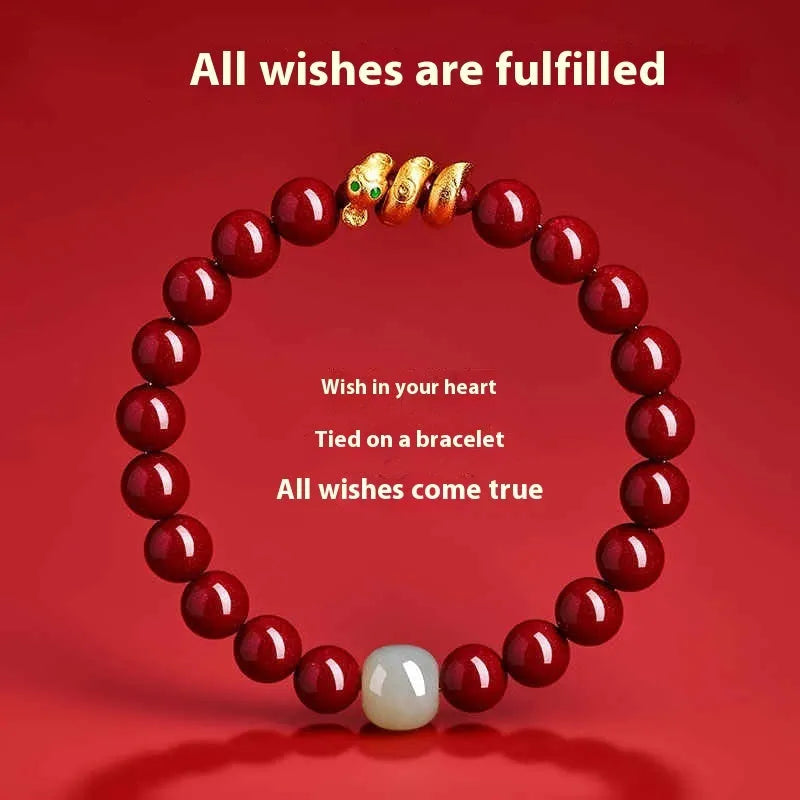 Handmade Chinese snake year bracelet with red cinnabar beads on a black cord.