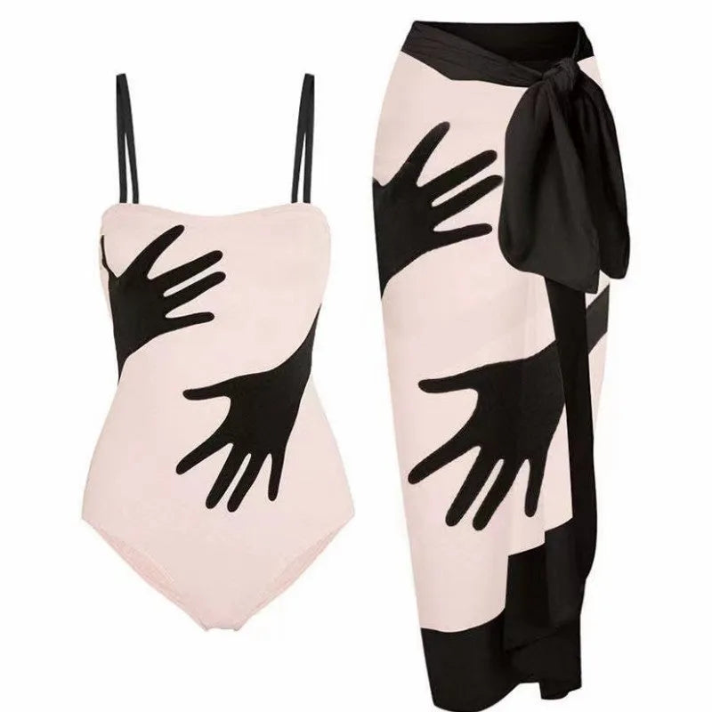 Women's patterned bikini swimsuit with a lightweight white tulle skirt attached.