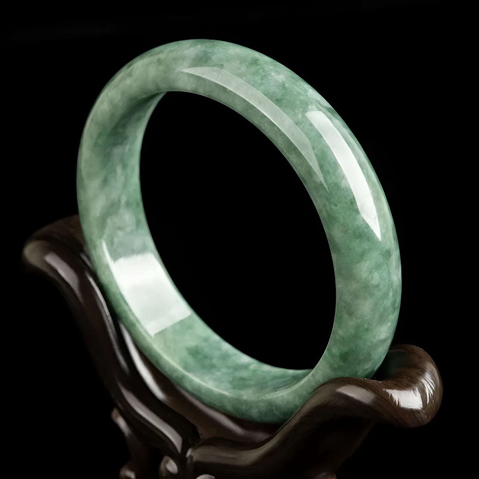 Deep pea green jade bracelet for women on a gift box, with certificate.