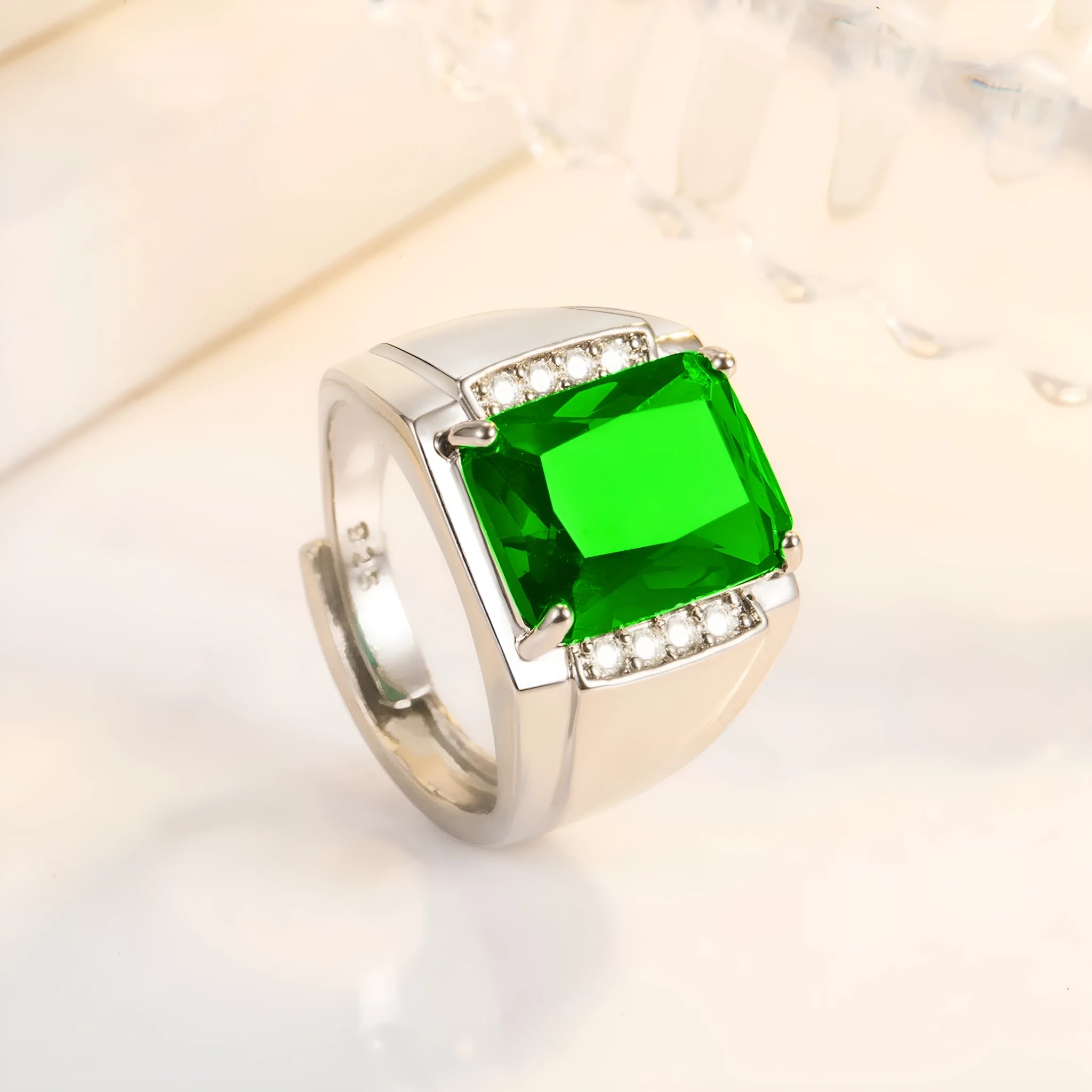 Adjustable open geometric ring with a coloured rhinestone on a copper band.