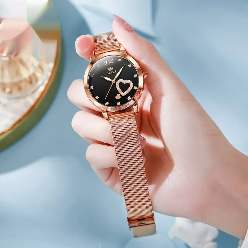 Women's rose gold fashion watch with mesh strap showing choice of six dial colours: white, black, blue, red, pink, green.