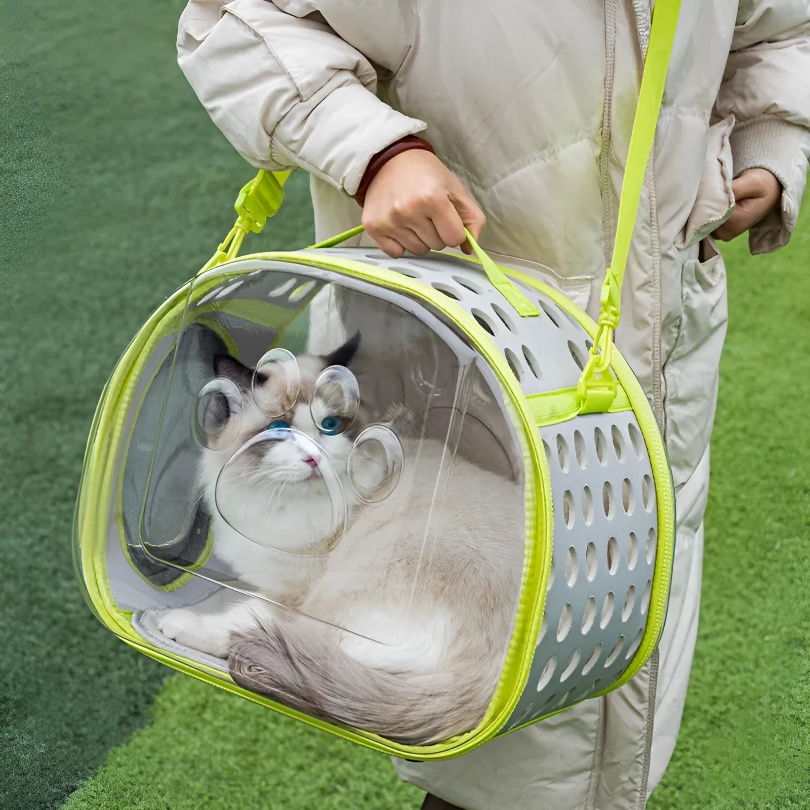 Transparent space capsule cat backpack carrier in grass green colour showing hard EVA construction and dimensions for cats up to 9kg