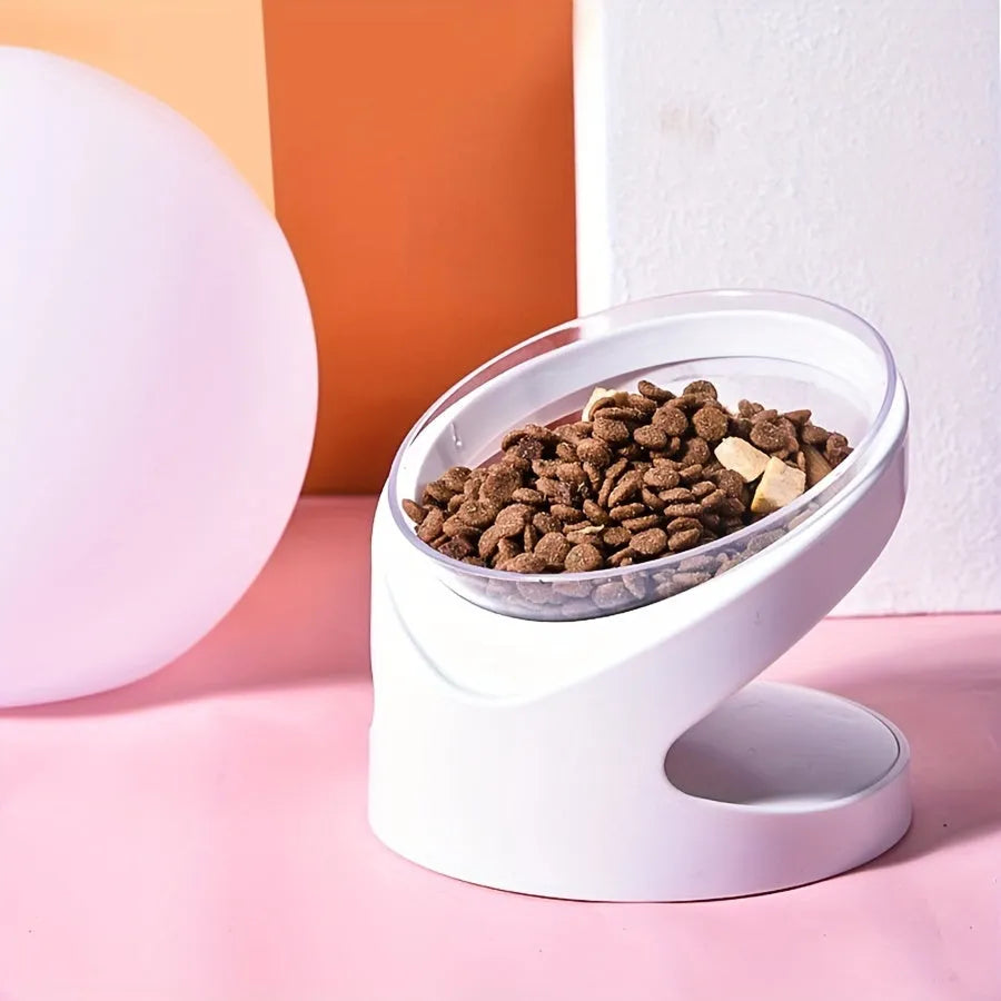 Clear plastic tilted cat food dish on a 7cm tall white plastic elevated base.