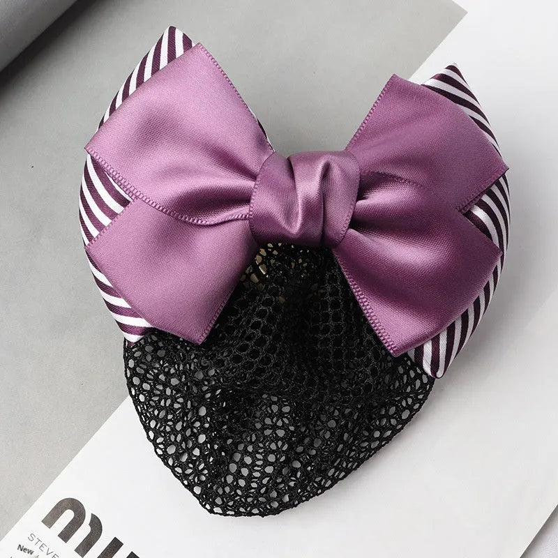 Professional hair clip with a black net pocket and a red flower bow ornament on a white background.