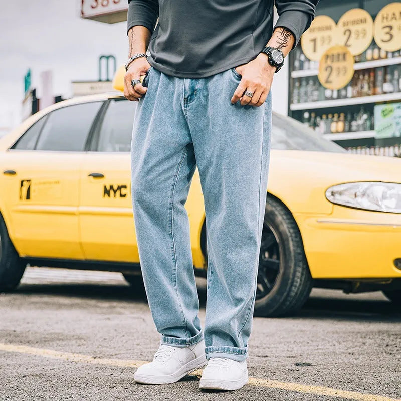 Men's loose straight jeans in dark blue colour showing mid waist and straight leg design