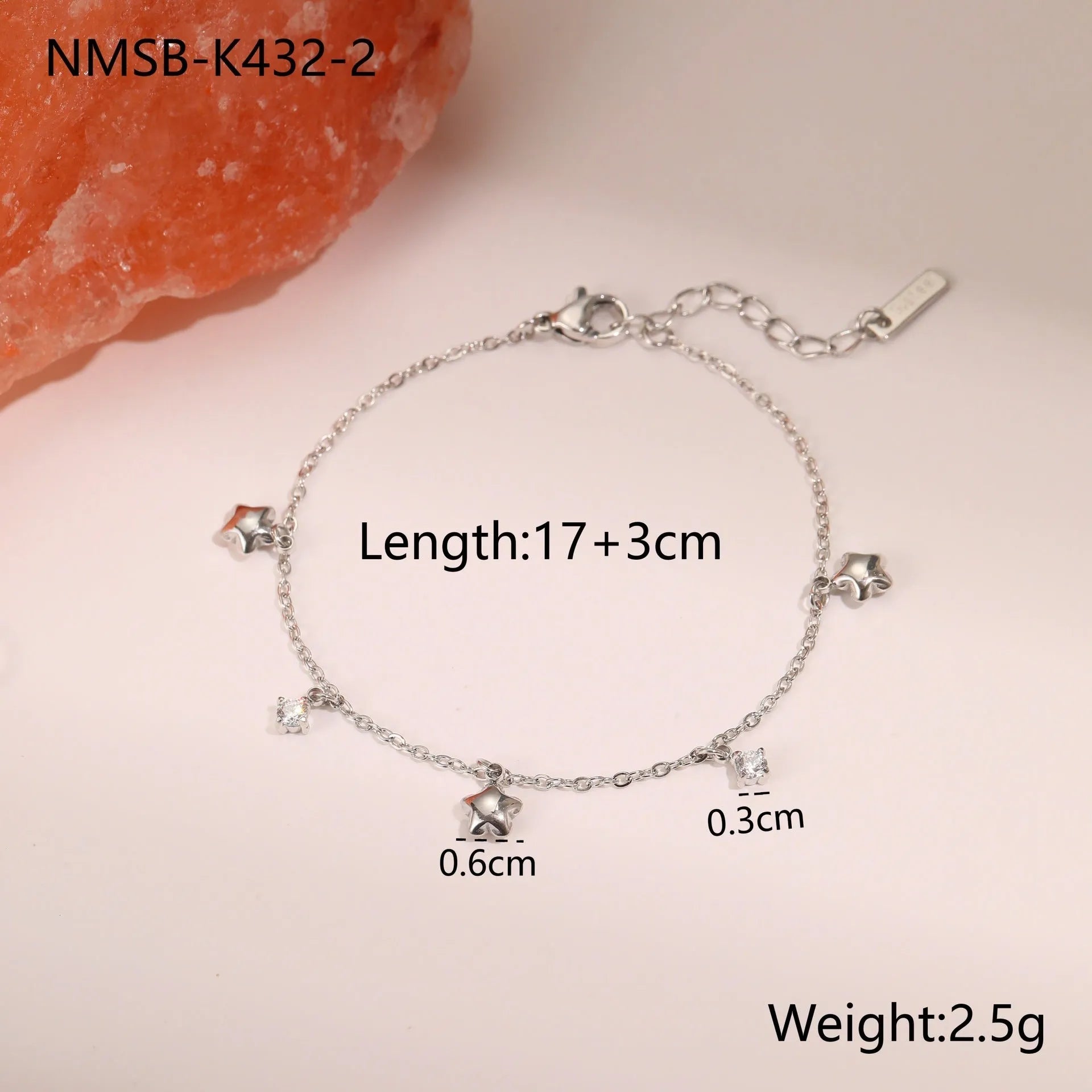 Women's stainless steel bracelet with 18K gold plating and a geometric hexagonal star zircon pendant.