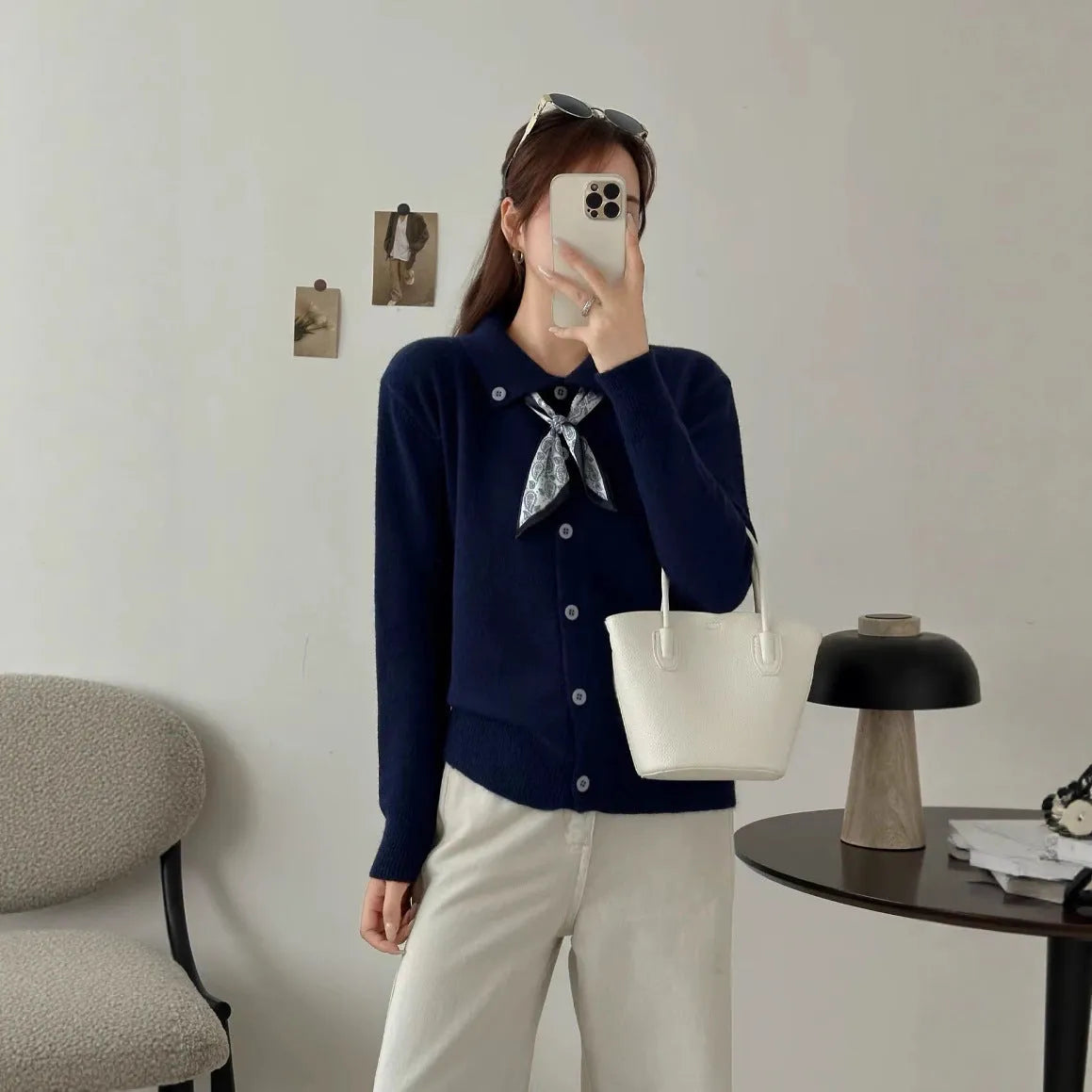 Beige lapel scarf cardigan sweater with long sleeves and splicing details on a model.
