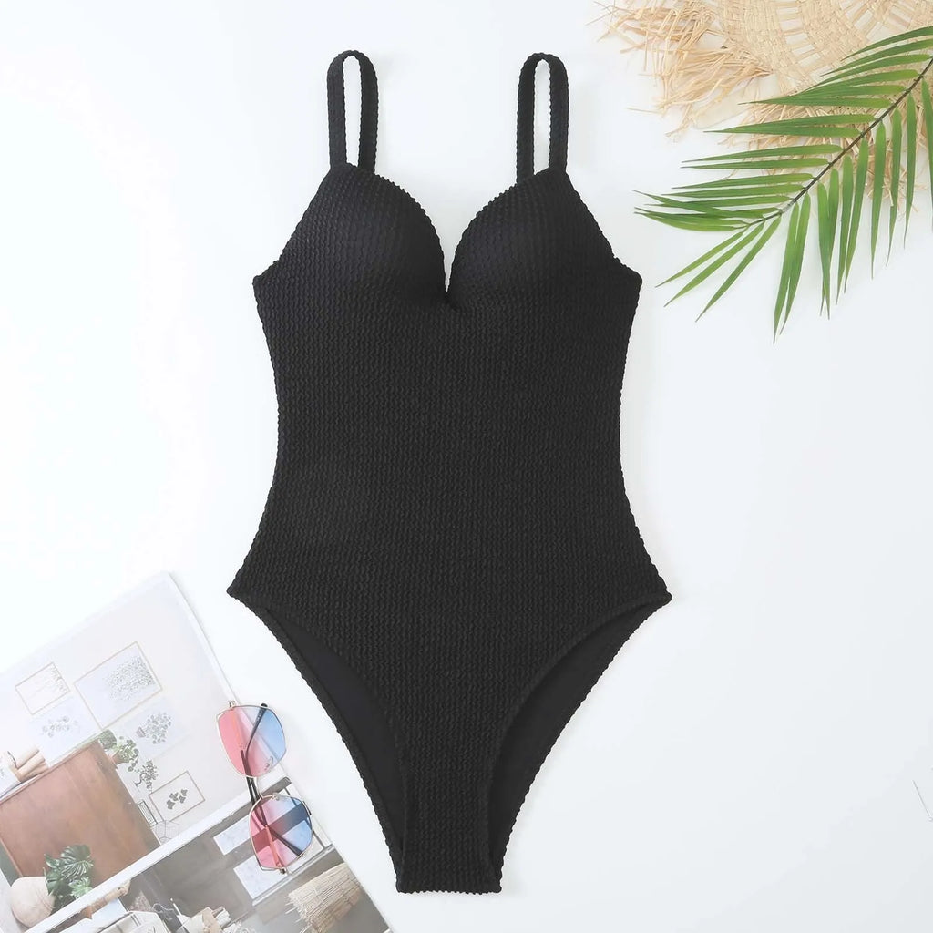 Women's one-piece swimsuit with sunken stripe pattern in polyester fabric, shown in multiple colour options