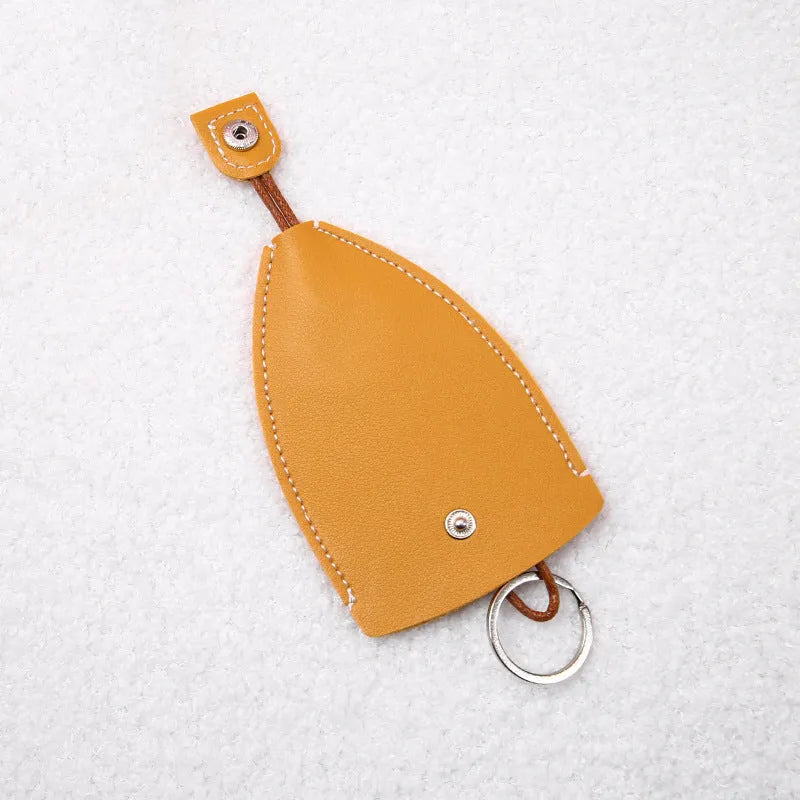 Cartoon pull-out key case in PU leather showing design options including resin fruit and big cartoon animal prints.
