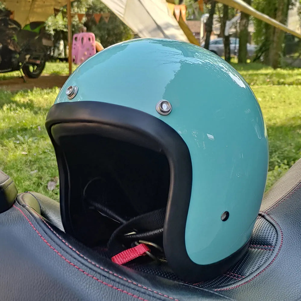 Retro-style half helmet for motorcycles with a fibreglass shell shown in a cement grey colour.