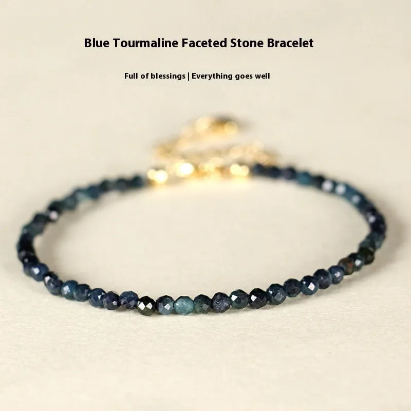 Women's blue tourmaline bracelet with 3mm beads and gold spacer beads