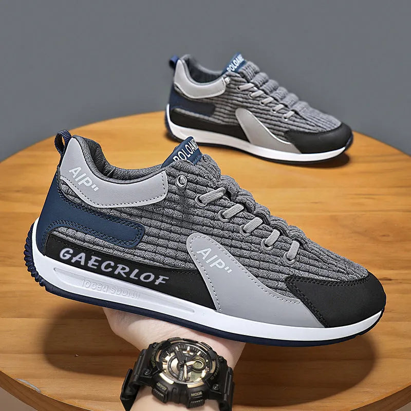 Men's grey and green mesh running shoes with round toe and lace-up front