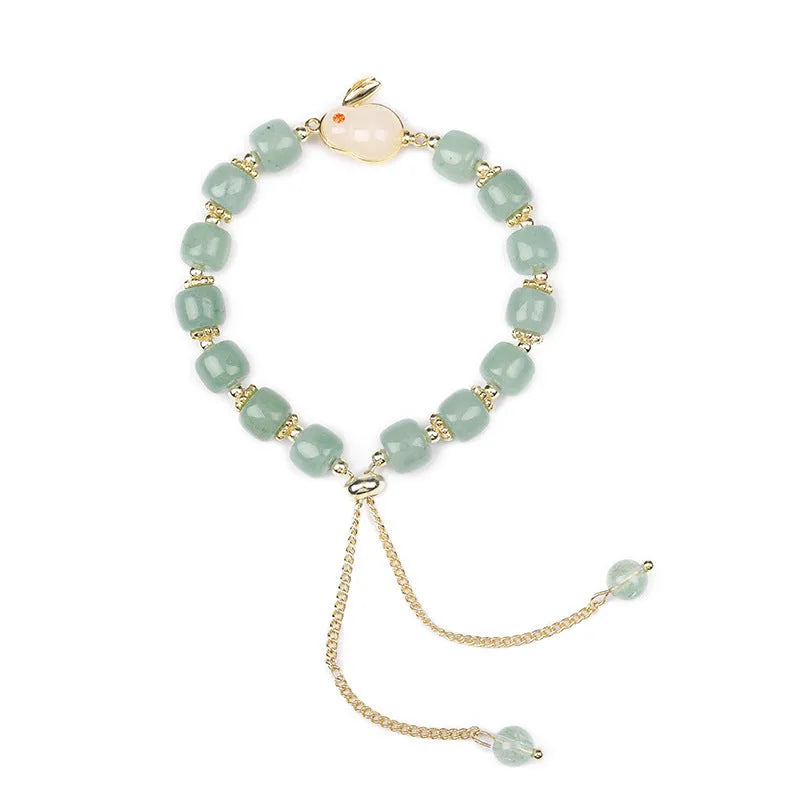 Women's rabbit charm bracelet with natural stone beads and gold accents