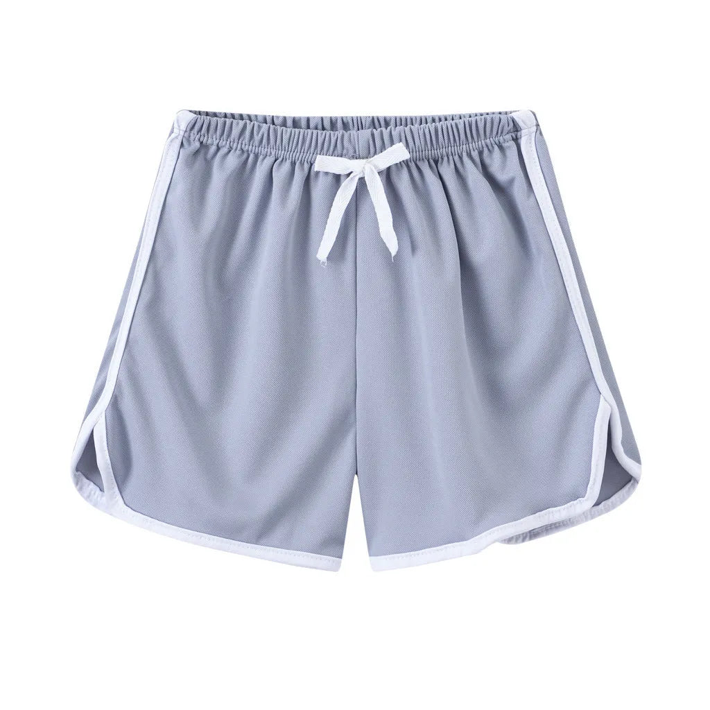 Children's polyester beach shorts in various colours and patterns including stripes, prints and solid options