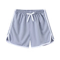 Children's polyester beach shorts in various colours and patterns including stripes, prints and solid options