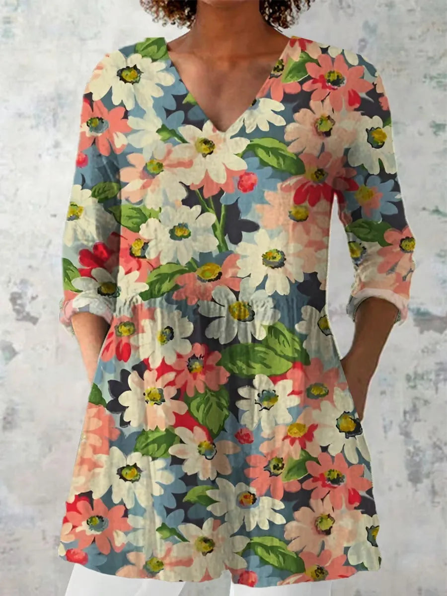 Woman wearing a retro slim fit, digitally printed long-sleeved top in a floral design.