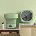 Mini foldable washing machine in green with blue light sterilisation and drain basket