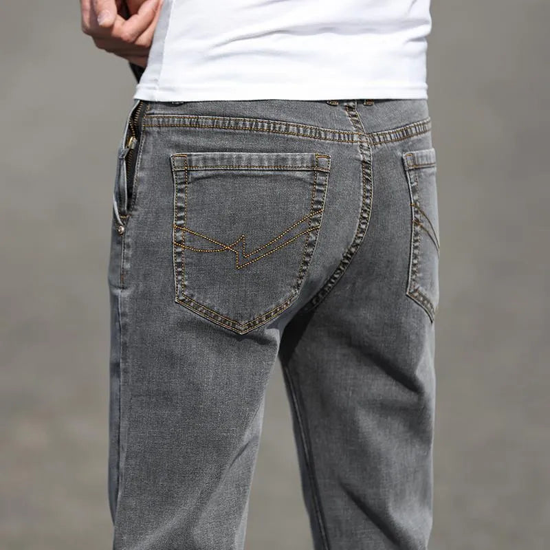 Men's straight leg jeans in smoky grey colour with a low waist and zipper fly