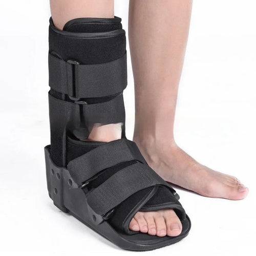Grey Achilles tendon rehabilitation boot with aluminium struts and adjustable straps.
