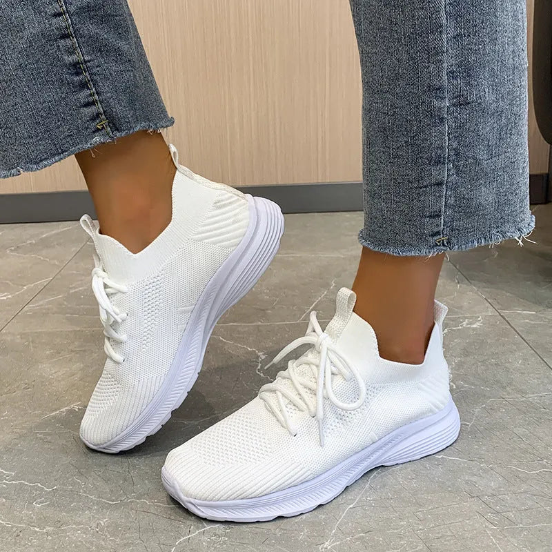 Women's mesh running shoes in creamy white with English muffin heel detail